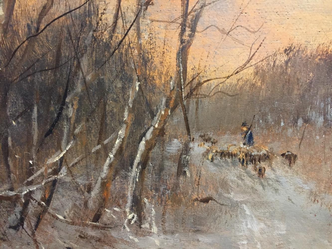 Shepherd with his sheep in the wintertime 