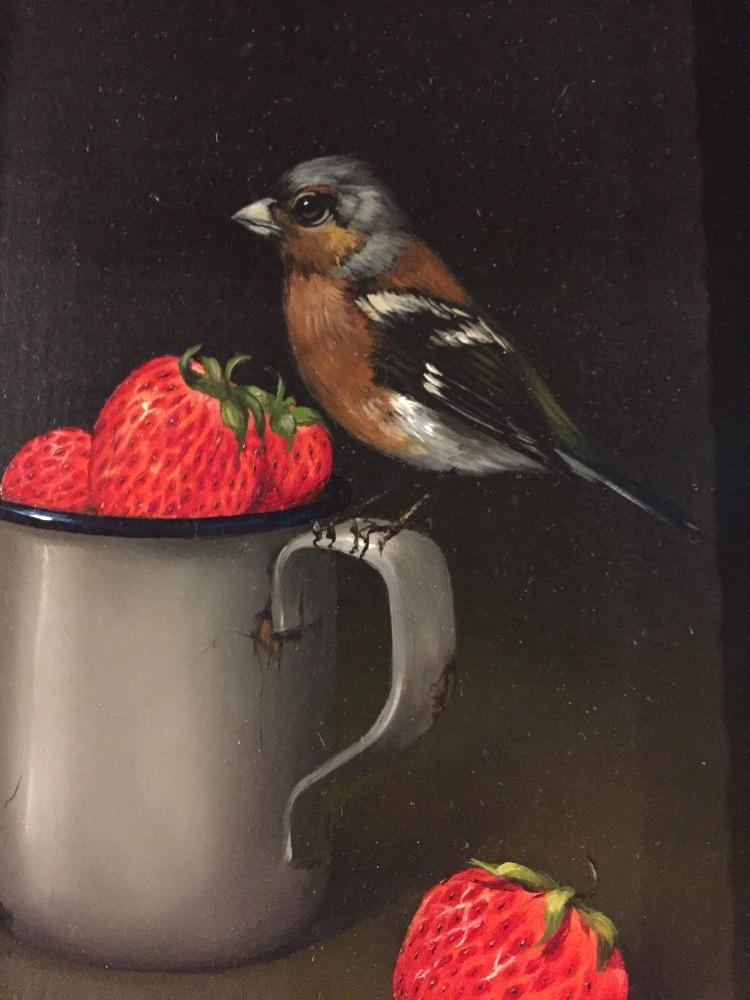 Bird eating strawberries