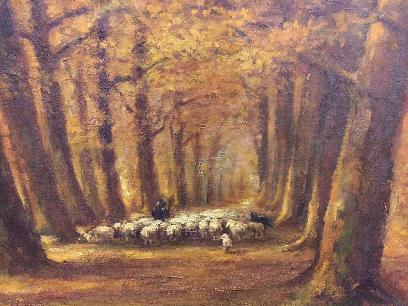 Shepherd with sheep in the forest 